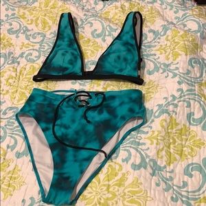 Medium sized turquoise high waisted bathing suit